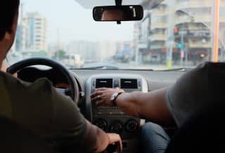 two person riding vehicle during daytime